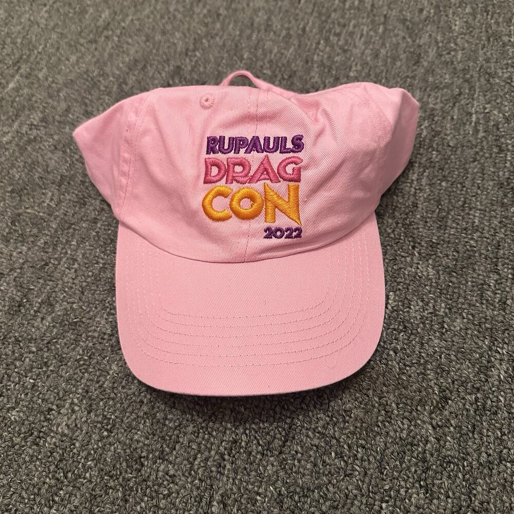 pink baseball cap embroidered "RuPaul's DragCon 2022